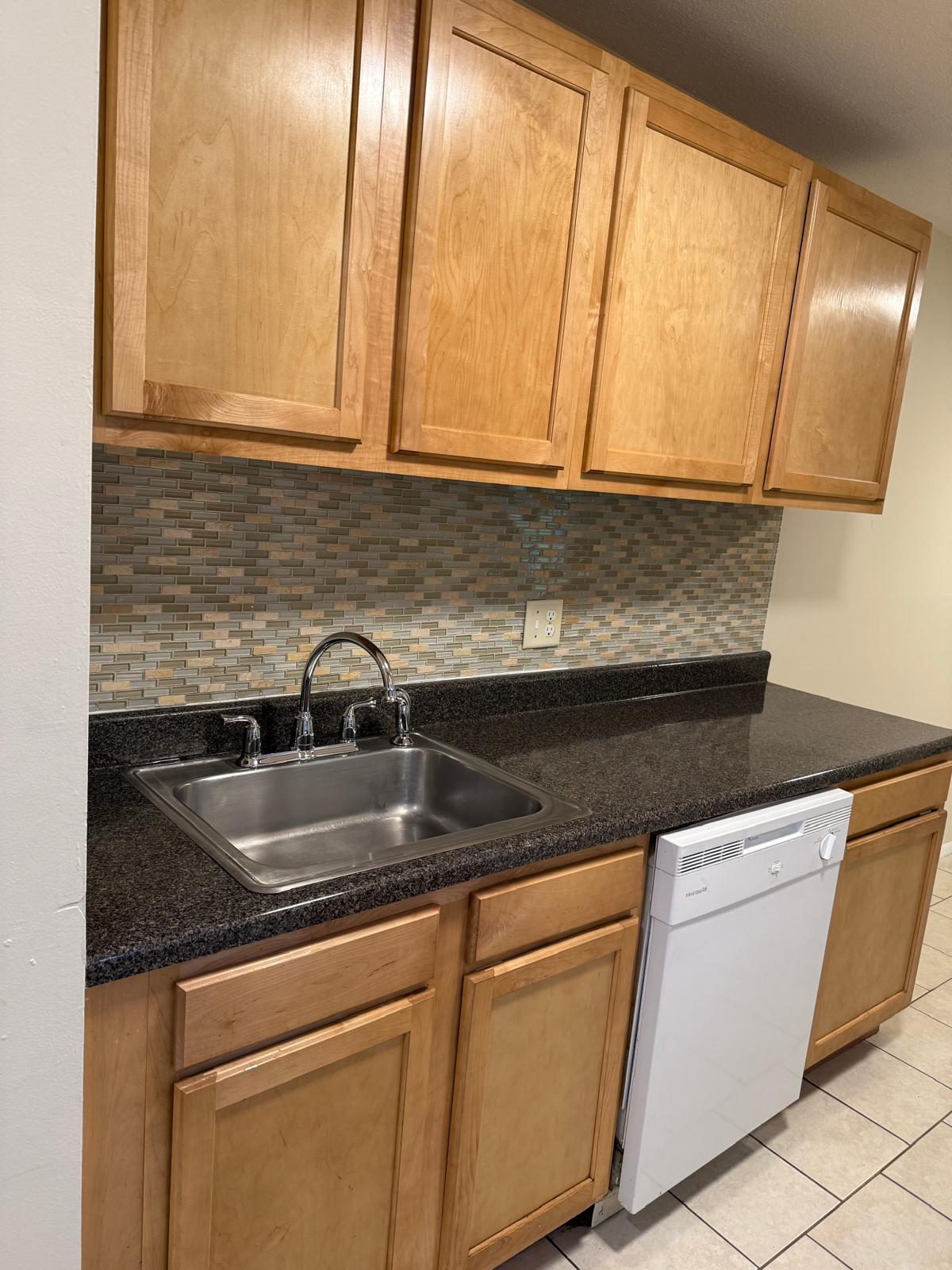 Kitchen counter and sink cleaned by D&D Cleaning Services